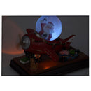 Kersttafereel met sneeuw, verlichting en muziek