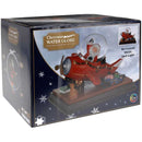 Kersttafereel met sneeuw, verlichting en muziek